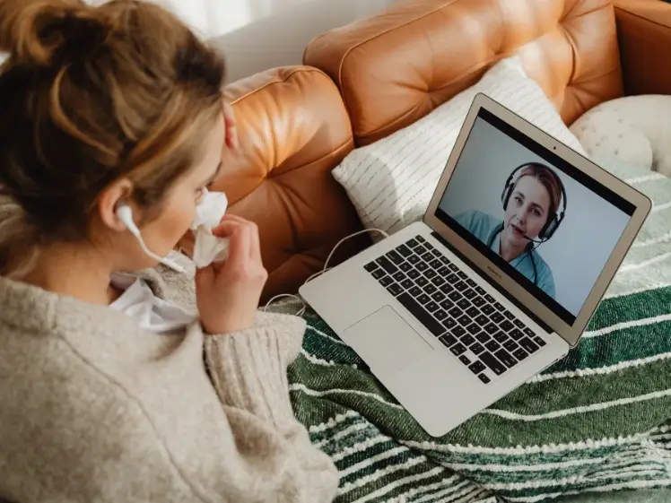 Person using a mobile phone for online therapy and affordable mental health support