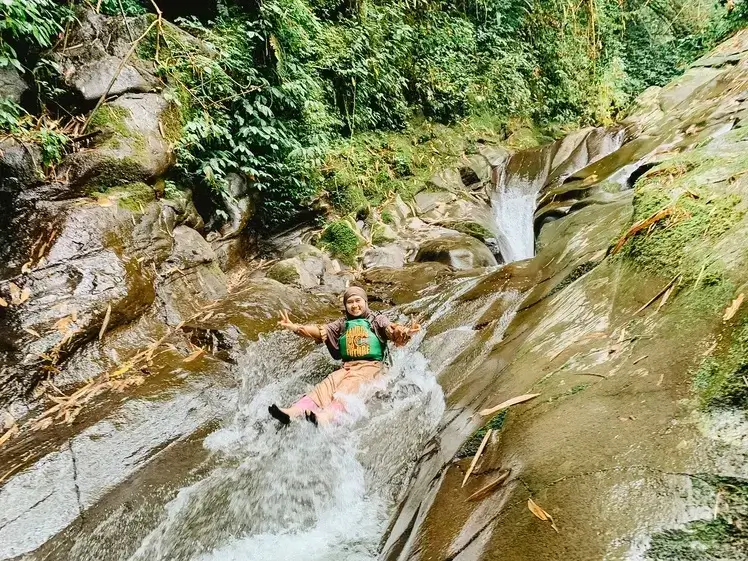 slide down on a natural rocks at bhumi bambu