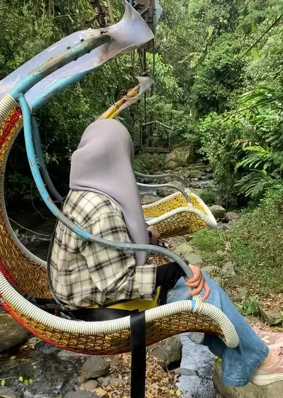 Keranjang Sultan ride suspended above the river at Situ Gunung